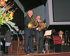 Professor Holmes demonstrate the physics of brass instruments